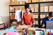© ALTO IMAGES/Stocksy - Happy multiracial colleagues working in warehouse