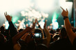 © Pixel Stories/Stocksy - Anonymous crowd at a concert. People enjoying live music. Music stage.