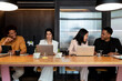 © Bisual Studio/Stocksy - Positive employees working on business project