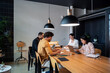 © Bisual Studio/Stocksy - Diverse employees working in office
