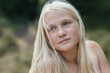 © Evgenij Yulkin/Stocksy - Blonde teen girl outdoors