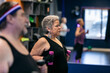 © Sean Locke/Stocksy - Senior Hispanic Woman Using Weights To Exercise
