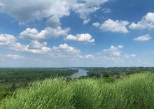 Danube River, Green Grass And Blue Sky
