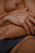 © Ivan Andrianov/Stocksy - Masculine Body Intimacy Close-up
