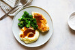 © Nadine Greeff/Stocksy - Plate of food with gravy chicken and veg