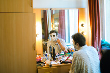 Actor  In Front Of A Mirror Makes Make-up Himself