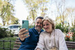 © Pedro Merino/Stocksy - Mature couple taking selfie on smartphone