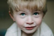 © Francesca Russell/Stocksy - Portrait of blonde boy