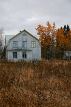 Abandoned Wooden House On Moody Fall Evening