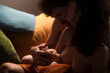 © Ibai Acevedo/Stocksy - Tender family portrait of newborn breastfeeding