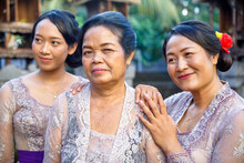 Three Generations Of Balinese Wearing Traditional Clothes