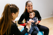 Mother And Baby Attending A Postpartum Recovery Class