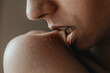 © Anastasia Mihaylova (Shpara)/Stocksy - Сlose up photo of lips biting the skin on shoulder