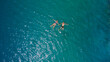 © Yakov Knyazev/Stocksy - young man and woman drone selfie in the sea