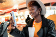 © Santi Nuñez/Stocksy - Cool woman drinking a smoothie