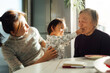 © ZQZ Studio/Stocksy - Four generations family at home
