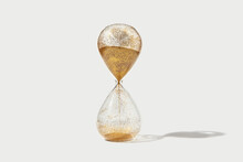 Hourglass With Flowing Golden Sand Inside