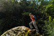 © Luis Herrera/Stocksy - woman hiking in the forest