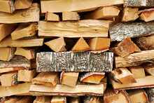 Texture Of A Stack Of Chopped And Stacked Firewood In A Village. Abstract Backgrounds
