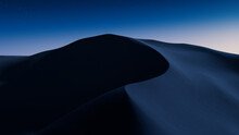 Undulating Sand Dunes Form An Empty Desert Landscape. Dawn Background With Blue Gradient Starry Sky.