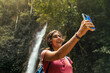 © Luis Herrera/Stocksy - Travel Woman Taking Selfie In Nature