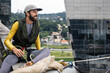 © Luciano Spinelli/Stocksy - Man doing slackline between two buildings