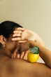 © Sophia Hsin/Stocksy - Young woman holding lemon