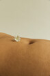 © Sophia Hsin/Stocksy - Single jasmine flower with belly button