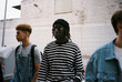 © BONNINSTUDIO/Stocksy - Diverse trendy youngsters on the street