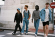 © BONNINSTUDIO/Stocksy - Diverse trendy youngsters waking on the street