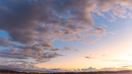 Wall Mural - Stunning sunset sky with pink pastel clouds. Sky replacement, editing, background, desktop, wallpaper. 