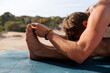 © Lucas Ottone/Stocksy - Man practicing yoga outdoors