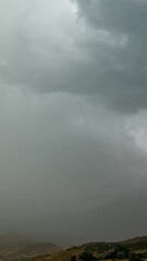 Wall Mural - Timelapse of rain pushing storm over Timpanogos Mountain during summer monsoon in Utah.