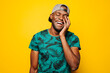 © VICTOR TORRES/Stocksy - Cheerful man touching cheek