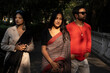 © Dream Lover/Stocksy - Three Indian young man and woman standing on a street at daytime