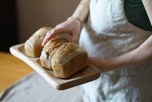 Hands Serving  Homemade Bread
