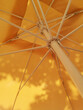 © Sonja Lekovic/Stocksy - yellow sun umbrella