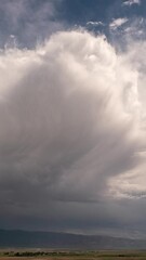 Wall Mural - Time-lapse of clouds moving over Lake Mountain in Utah past Fairfield at the tail end of a storm.