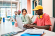 © Santi Nuñez/Stocksy - Happy people working in a creative coworking