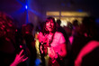 © Ibai Acevedo/Stocksy - Cheerful woman having fun at night party