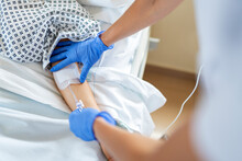 Nurse Giving Intravenous Analgesic