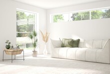 White Living Room With Sofa And Summer Landscape In Window. Scandinavian Interior Design. 3D Illustration