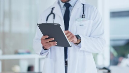 Poster - Hands of a doctor using a tablet in the hospital. Closeup of a healthcare professional using a wireless device in a clinic. GP researching the latest breakthrough and innovation in medicine online