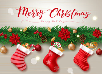 Wall Mural - Christmas garland vector design. Merry christmas greeting text in garland decoration with hanging santa sack, poinsettia, balls and candy cane elements for holiday season. Vector illustration.
