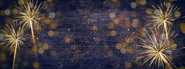 New Year 2023, New Year's Eve, celebration party or festival  background panorama long - Firework Fireworks on rustic blue wooden wood texture.