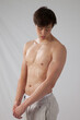 © Allen Penton - Cute young man with his shirt off and looking serious