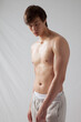 © Allen Penton - Cute young man with his shirt off and looking serious
