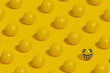 © kimi.exe - Yellow bouncing ball with a smile and teeth on a yellow background.