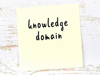 Yellow sheet of paper with word knowledge domain. Reminder concept