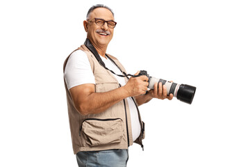 Poster - Mature man holding a professional camera and looking at camera